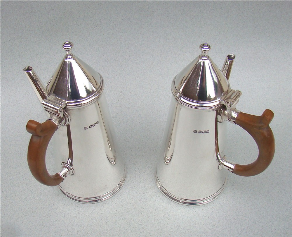 pair of silver coffee pots in the style of william mary by thomas bradbury sheffield 1933