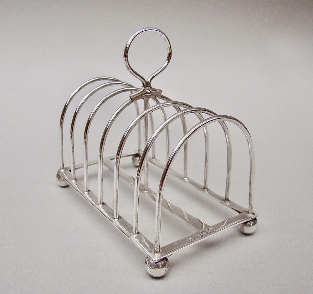 good edwardian solid silver toast rack by william hutton sons london 1901