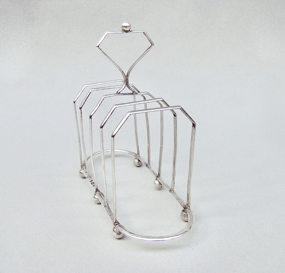 unusual victorian silver five division toast rack by the william devenport birmingham 1900