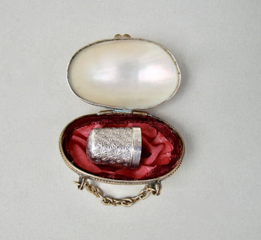 delightful sterling silver thimble in french mother of pearl chatelaine thimble case circa 1890