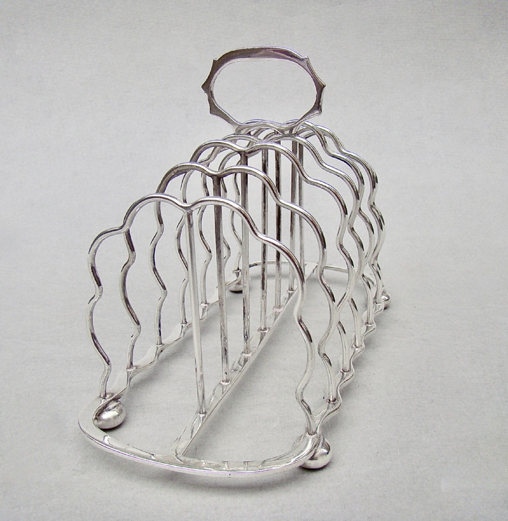 good edwardian solid silver toast rack by s garrard london 1905