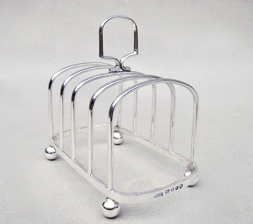 good george v solid silver toast rack by j b chatterley sons london 1935