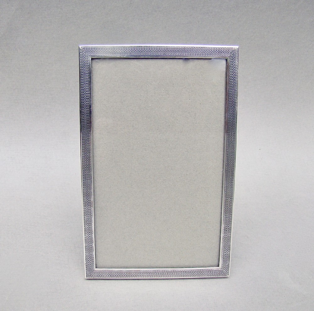 elegant art deco engineturned silver photo frame by green cadbury ltd birmingham 1931